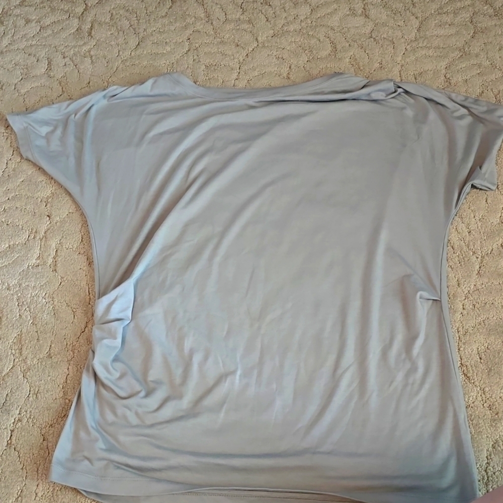 Atheltica light green shirt that raises up on the side.  Size M